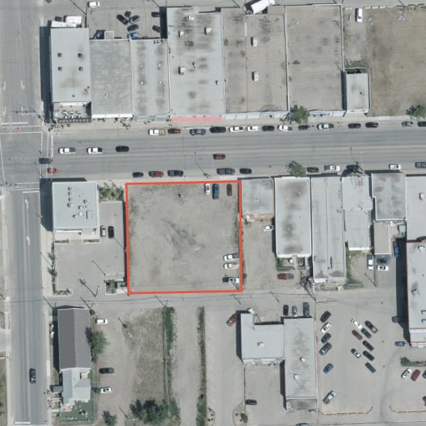 An aerial view of three vacant lots available for development.